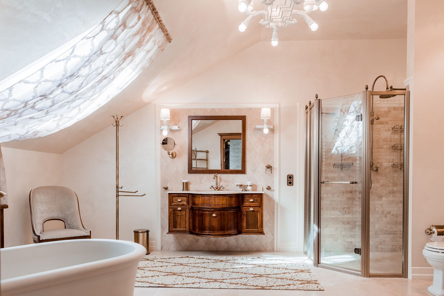 Bathroom fixtures including a wood vanity, freestanding bathtub, and glass shower