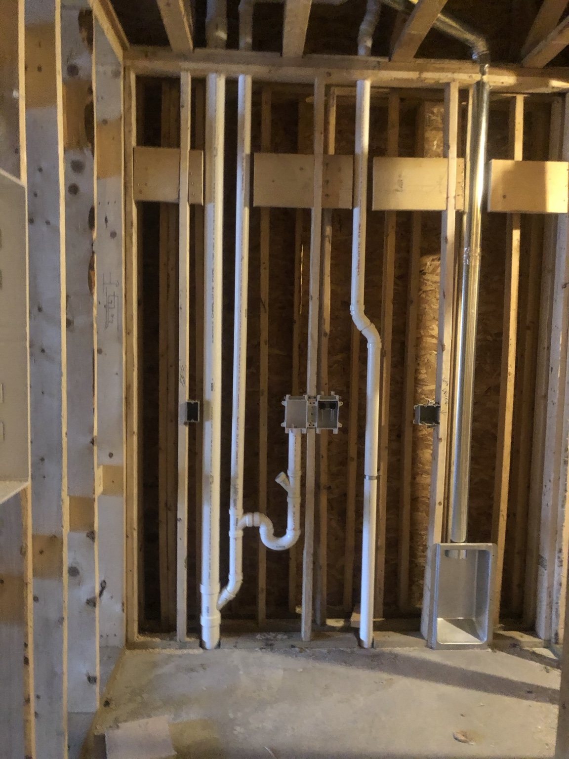 A-1 room plumbing rough-in with exposed wall framing