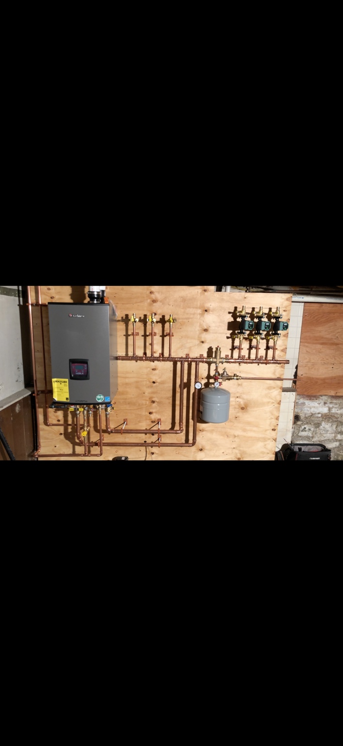 A-1 wall-mounted hydronic heating equipment with copper piping and circulators
