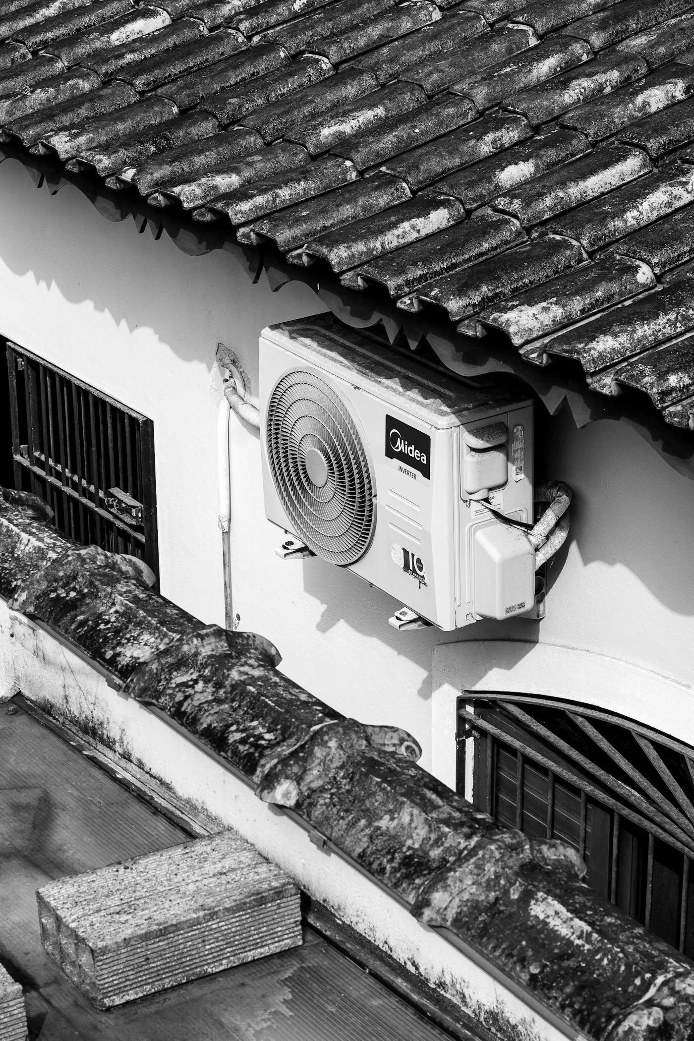Outdoor inverter unit mounted on wall brackets